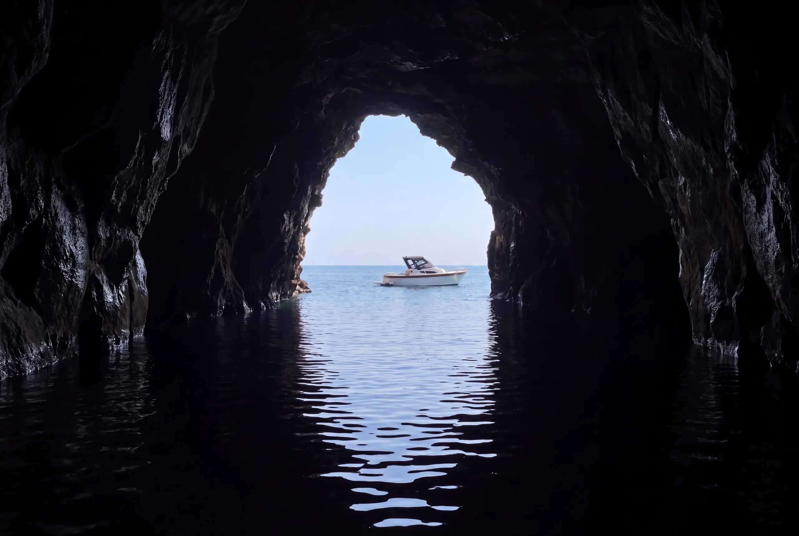 The boat waiting outside the cave